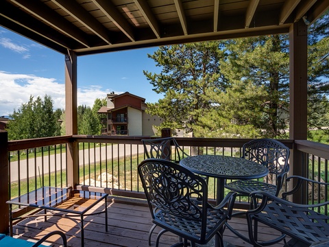 Your private balcony offers a peaceful spot to enjoy morning coffee or evening wine, framed by towering pines and overlooking the serene mountain landscape.