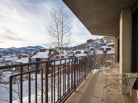 Step onto your private balcony and take in breathtaking snow-covered mountain views. Perfect for morning coffee or evening relaxation, the scenic winter landscape surrounds you.