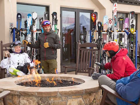Gather around the outdoor fireplace after an exhilarating day on the slopes, sharing stories and warming up with your group in a cozy ski-in setting.