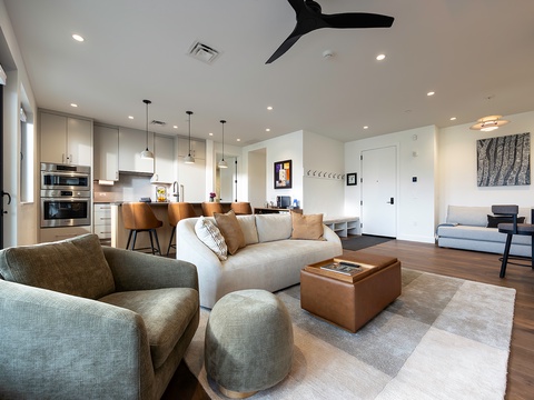 Settle into your spacious open-concept retreat, where modern design meets effortless comfort. Sleek kitchen, inviting lounge seating, and plenty of natural light create the perfect home base for your stay.