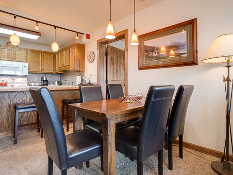 Gather around this welcoming dining table where your group can share meals and stories. The open layout connects seamlessly to the fully-equipped kitchen, making it easy to prepare and enjoy your favorite dishes together.