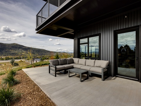 Modern patio with comfortable seating where you'll enjoy sweeping mountain vistas and the gentle desert breeze.