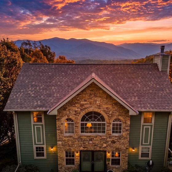A stunning mountain retreat nestled among autumn foliage, with dramatic layered peaks rising in the distance beyond majestic trees, captured at the golden hour when warm light bathes the surrounding landscape.