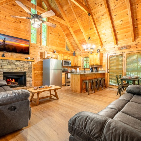 Unwind in your spacious mountain retreat with a cozy stone fireplace and a total of 4 recliners that invites you to relax after a day of adventure.