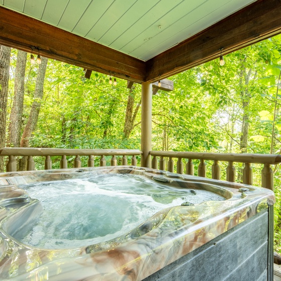 Slip into your private hot tub and let the forest surround you—birdsong, rustling leaves, and pure mountain air all around.