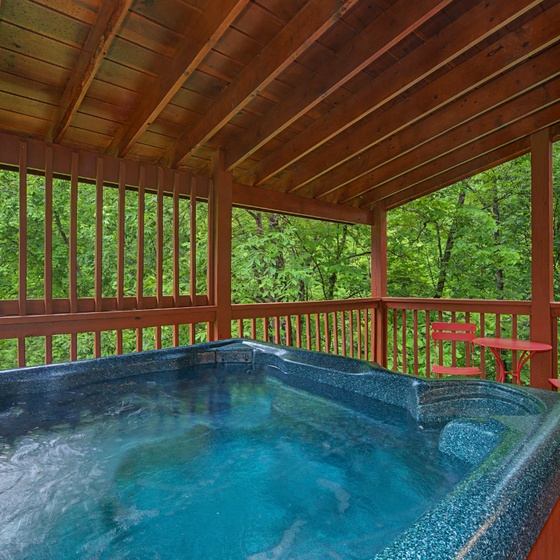 Soak away your cares in your private covered hot tub, surrounded by lush forest views and the peaceful sounds of nature.