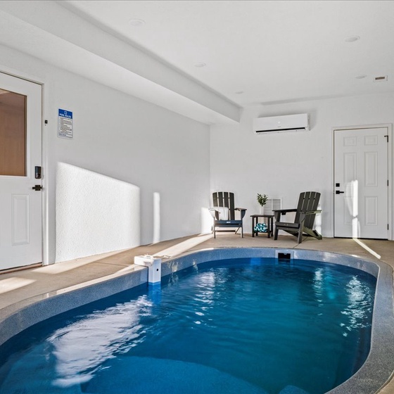 Your private indoor pool awaits, with poolside chairs and climate control for year-round relaxation.