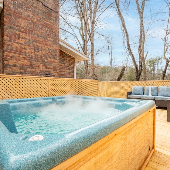 Soak in your bubbling hot tub on the secluded deck, surrounded by comfortable outdoor seating.
