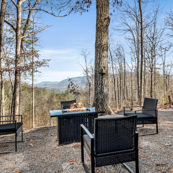 Grassy Paradise's crackling firepit overlooking mountain views