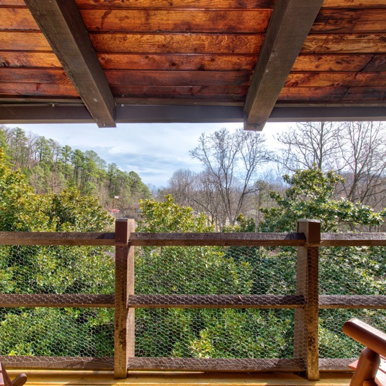Step onto your private covered balcony and breathe in the fresh air while enjoying peaceful views of lush greenery and rolling hills.