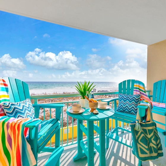 Welcome to Pelican Isle 215 - The Emerald Spritz! Sip your morning coffee on your private balcony while watching waves dance across pristine white sand.
