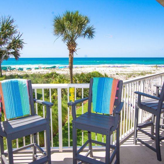 Wake up to this stunning beachfront view from your private balcony, where morning coffee meets endless ocean horizons and swaying palms.