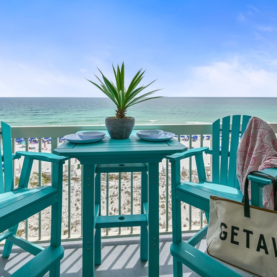 Welcome to Pelican Beach 604 - Shore Thing! Sip your morning coffee at this turquoise dining set while soaking in pristine beach views from your private balcony paradise.