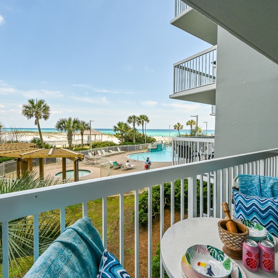 Welcome to Pelican Beach 215 - Beach Blessing! Soak up stunning beach views from your private balcony, perfectly positioned to watch the waves and palm trees sway.