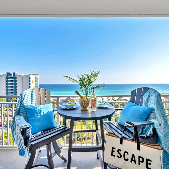 Sip your morning coffee on this stunning oceanfront balcony with sweeping sea views and cozy seating for two.