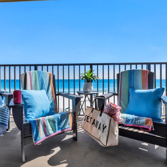 Sink into cozy balcony chairs with colorful throws and sip your morning coffee while endless Gulf views stretch before you.