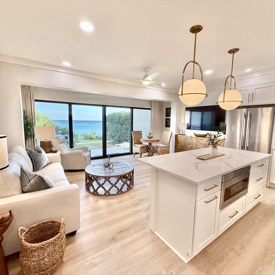 Wake up to breathtaking ocean views from this modern open-concept living space where your morning coffee pairs perfectly with stunning blues beyond.