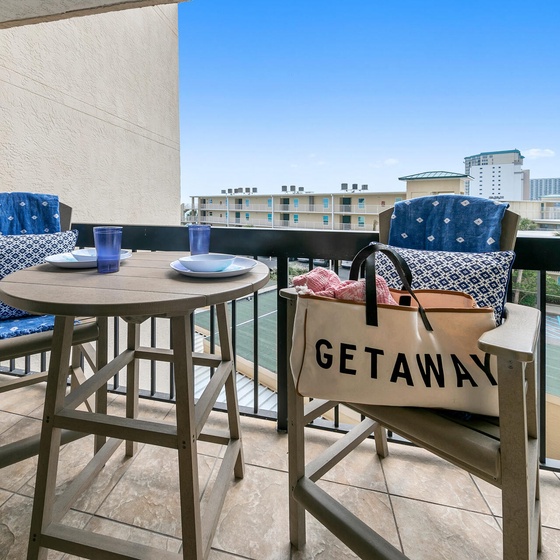 Step onto your private balcony and savor morning coffee while enjoying city views from your outdoor dining space.