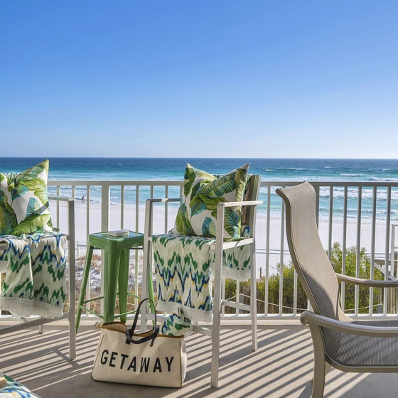 Unwind on your private oceanfront balcony with tropical-themed seating while endless waves roll over the shore.
