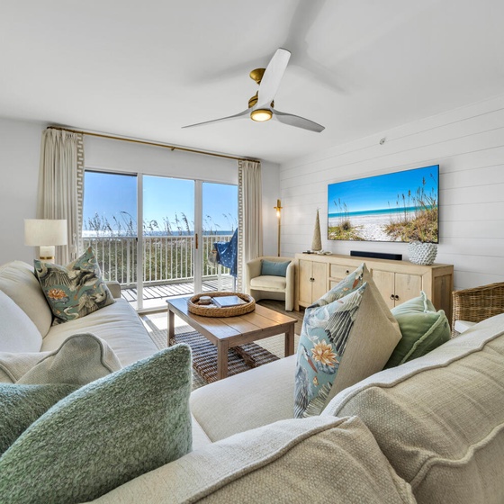 Sink into plush coastal-themed seating while gulf breezes flow through your private balcony doors, creating the perfect retreat.
