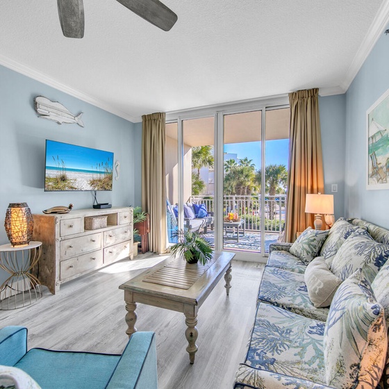 Welcome to Waterscape C301 - Mermaid Cove! Unwind in your coastal living room with tropical decor and balcony views of swaying palms.