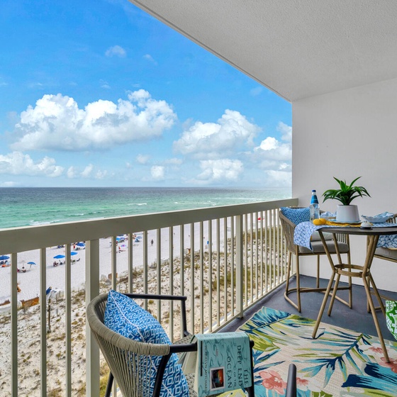 Welcome to Pelican Beach 603 - Starfish by the Sea! Your private balcony offers sweeping ocean views where you'll sip morning coffee and watch beachgoers below on pristine white sand.