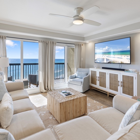 Relax in this bright living space where stunning ocean views and plush seating create your perfect seaside retreat.