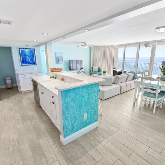 Step into your bright oceanfront haven where turquoise accents mirror the sea beyond your windows, creating a seamless coastal escape.