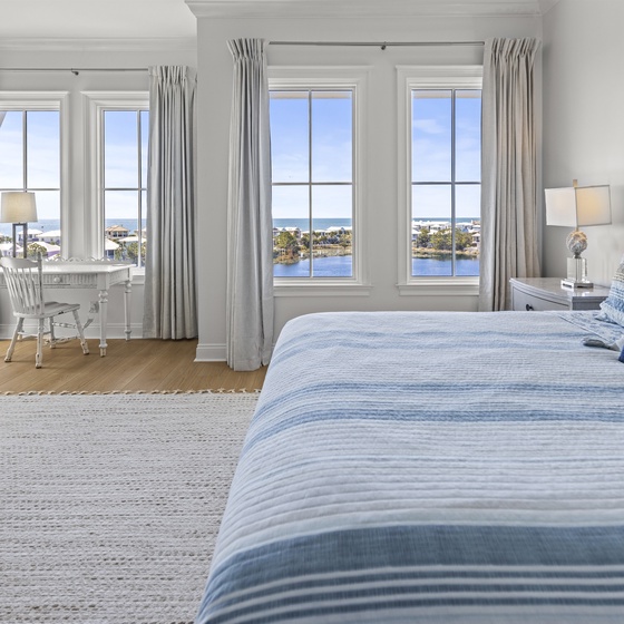 Wake up to breathtaking water views from your serene bedroom, where coastal charm meets comfort in every thoughtfully designed detail.