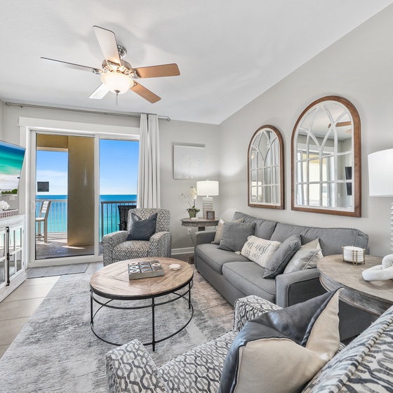 Sink into plush seating while ocean breezes flow through your bright living space, where stunning turquoise views await just beyond your private balcony.
