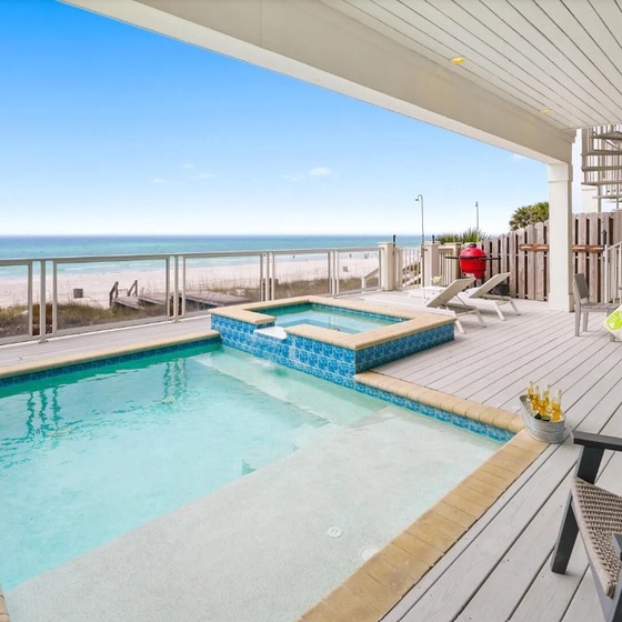 Enjoy your private pool and hot tub on this stunning beachfront deck, where crystal-clear waters meet endless ocean views.