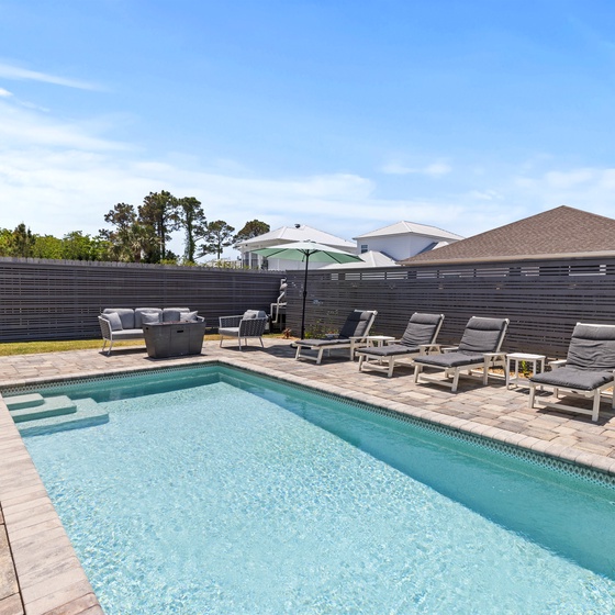 Your private pool awaits with sparkling waters, plush loungers for soaking up sunshine, and a built-in grill for poolside dining perfection.