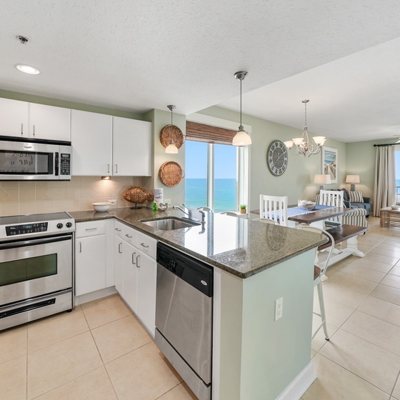 Cook your favorite meals in this bright, modern kitchen while ocean breezes drift through your windows and stunning sea views inspire.