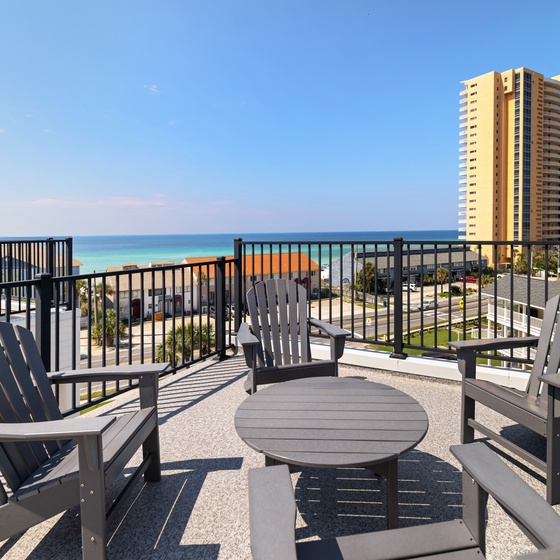 Settle into your private balcony seating and watch the turquoise waters stretch to the horizon. Perfect for morning coffee or evening unwinding with the ocean breeze.