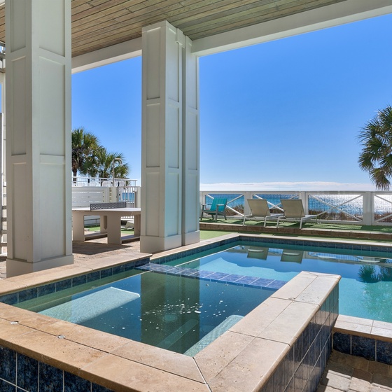 Dive into your private pool while soaking up stunning ocean views and Florida sunshine from this elevated terrace paradise.