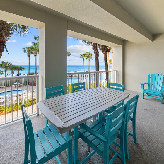 Your private balcony overlooking pristine beach and swaying palms offers the perfect spot for morning coffee or sunset dining.