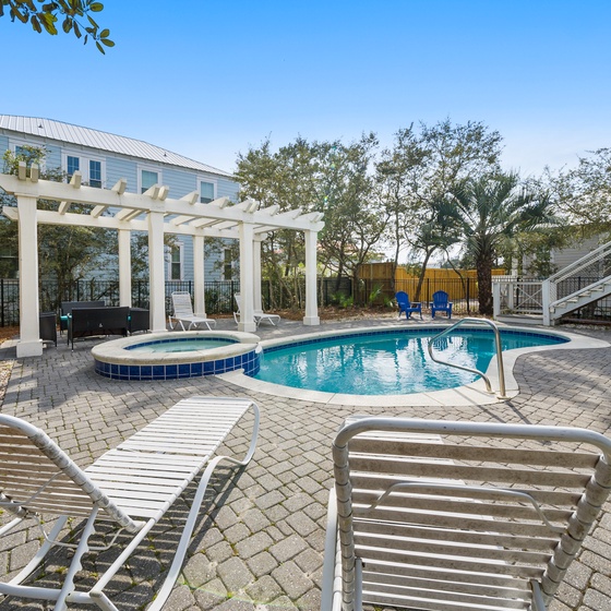 Dive into your private oasis with crystal-clear pool waters surrounded by elegant pergola shade and comfortable loungers for ultimate relaxation.
