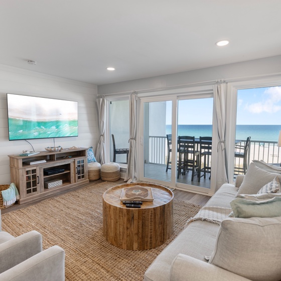 Sink into plush coastal comfort while gazing at endless ocean views from your private living space, where beach-inspired décor meets modern luxury.