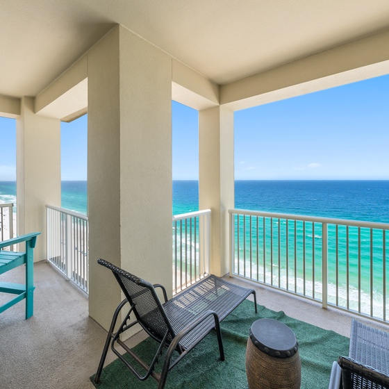 Step onto your private balcony and breathe in the ocean breeze while enjoying stunning sea views from your comfortable seating area.