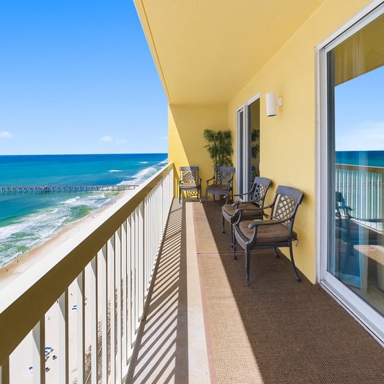 Wake up to stunning oceanfront views from your private balcony, where comfortable seating awaits your morning coffee moments.