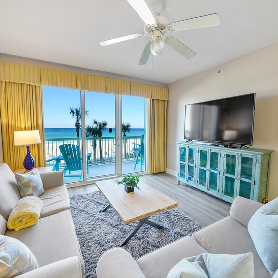 Relax in your bright living room with stunning ocean views and beach access from your private balcony.