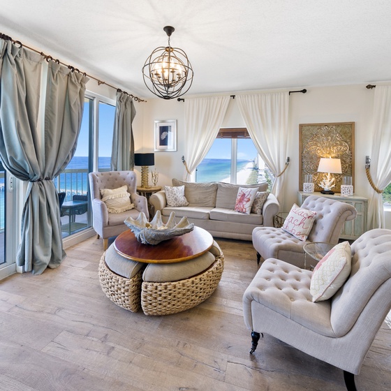 Sink into plush seating while breathtaking ocean views fill every window of your elegant living space.