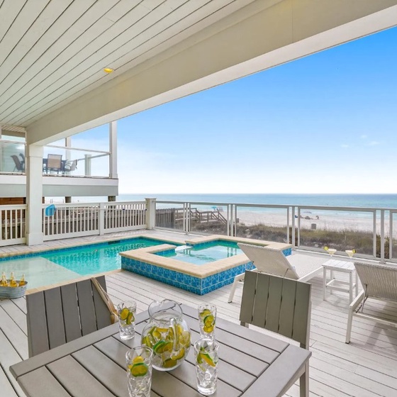Relax on your private deck with pool, hot tub, and stunning oceanfront views stretching to the horizon.