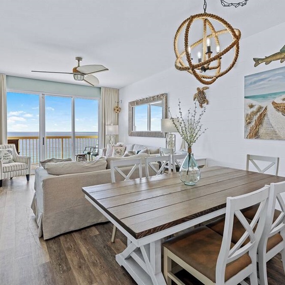 Coastal-chic open living space where you'll dine with ocean views through floor-to-ceiling windows and unwind in beach-inspired comfort.