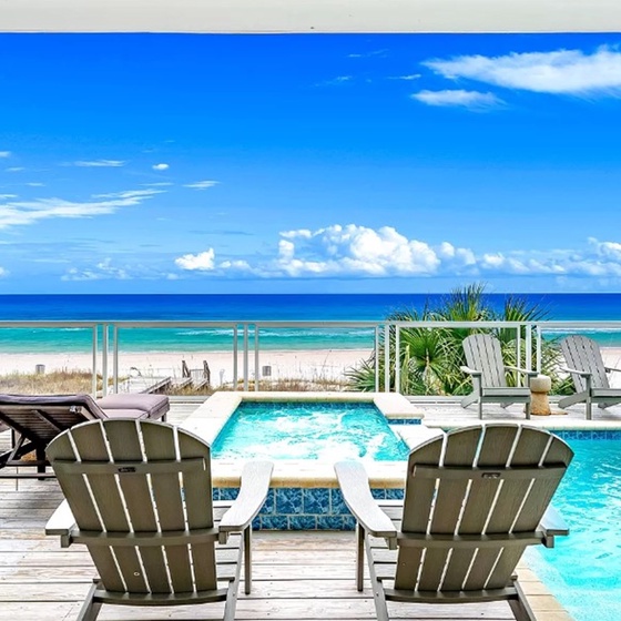 Your private oceanfront pool deck features stunning turquoise views, comfortable loungers, and direct beach access for the ultimate tropical escape.