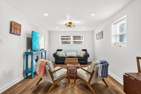 Settle into your bright, inviting living room with cozy seating, modern entertainment, and warm natural light streaming through the windows—perfect for relaxing after your adventures.