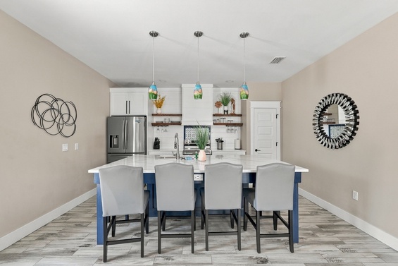 Step into your bright, open kitchen with a spacious island perfect for gathering with loved ones over meals and conversation.