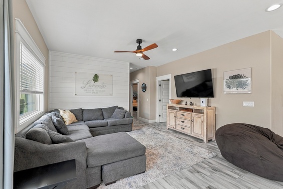 Sink into plush seating and unwind in your bright living area with coastal touches, soft textures, and everything you need for a laid-back stay.