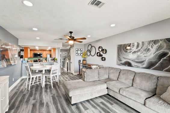 Settle into your modern retreat where a plush sectional and open-concept living create the perfect space to unwind. The fully equipped kitchen invites you to prepare meals while enjoying the seamless flow of this stylish, comfortable home.