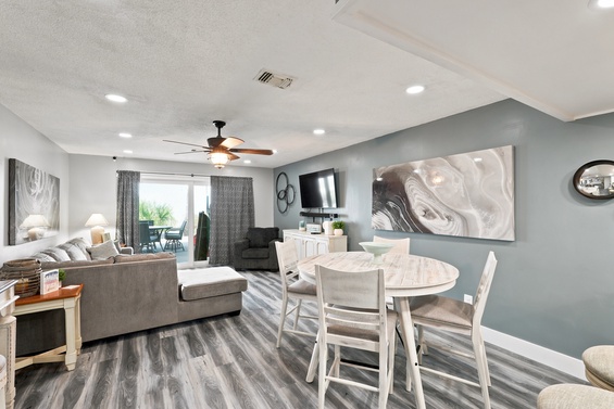 Unwind in your bright, modern living and dining area with cozy seating, flat-screen TV, and a welcoming space to gather with loved ones.
